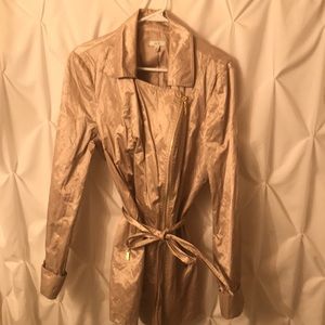 Woman’s gold raincoat